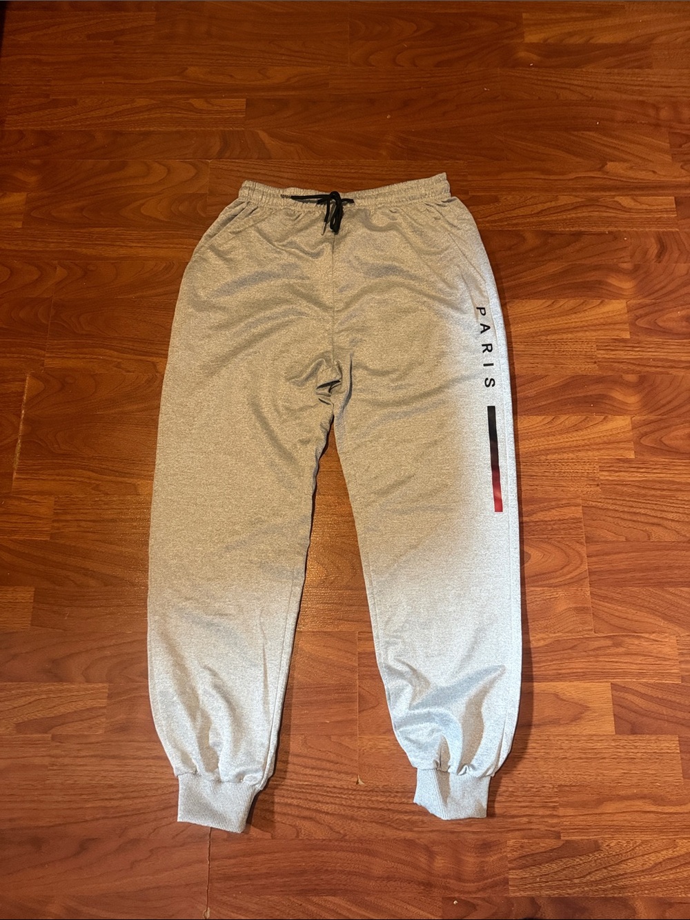 Que Men's Gray Joggers with Black & Red Side Stripe